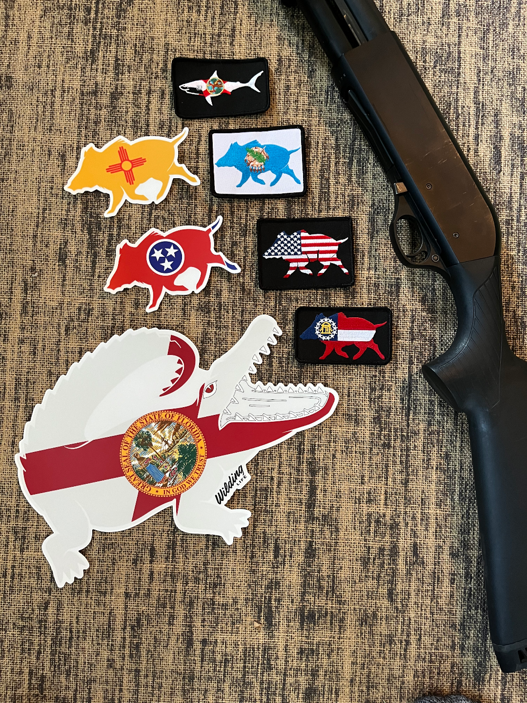 Set of colorful patches on a textured surface with a shotgun.