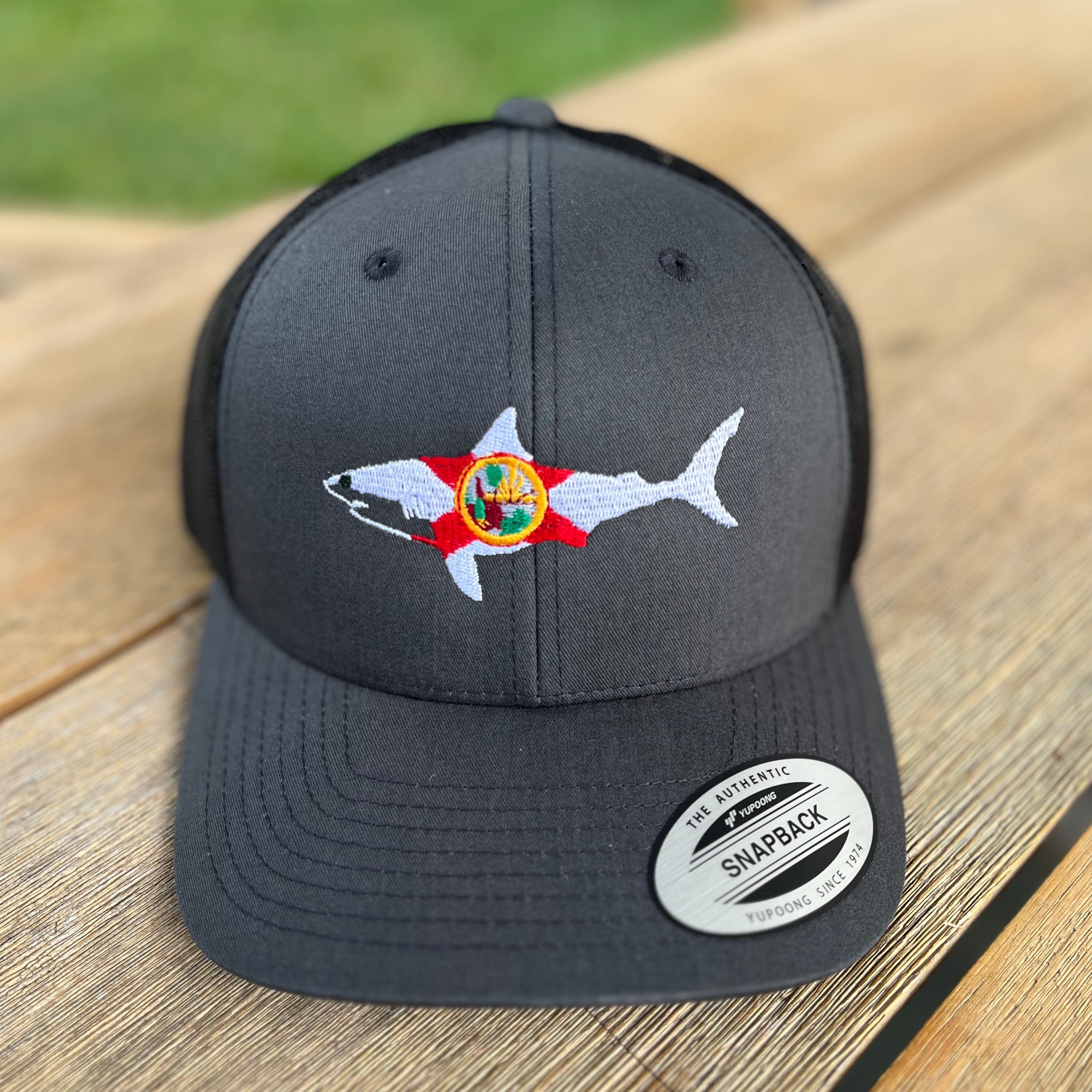 https://wildinglife.com/cdn/shop/products/florida-shark-trucker-hat-sale-763037.jpg?v=1704331847